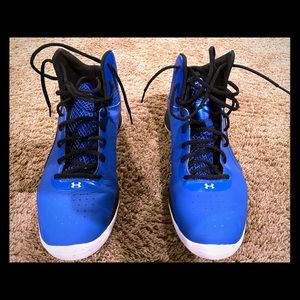 Under Armour Micro G high top basketball shoes.